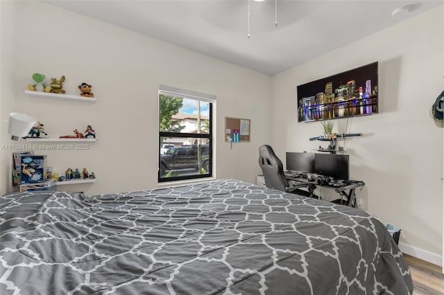 bedroom featuring ceiling fan and wood finished floors