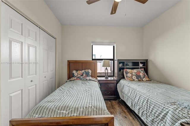 bedroom with ceiling fan, dark wood finished floors, and a closet