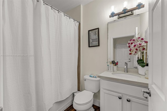 full bath with toilet, shower / bathtub combination with curtain, and vanity