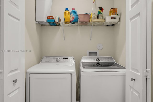 clothes washing area with laundry area and separate washer and dryer