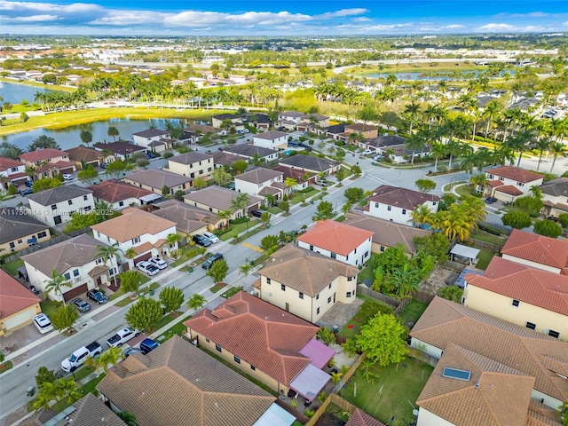 bird's eye view with a water view and a residential view