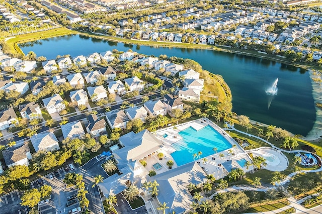 birds eye view of property with a water view and a residential view