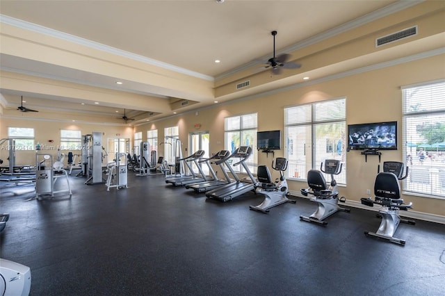 workout area featuring ornamental molding, visible vents, ceiling fan, and baseboards