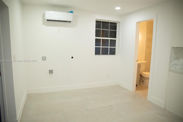 unfurnished room featuring recessed lighting, light tile patterned floors, baseboards, and a wall mounted AC