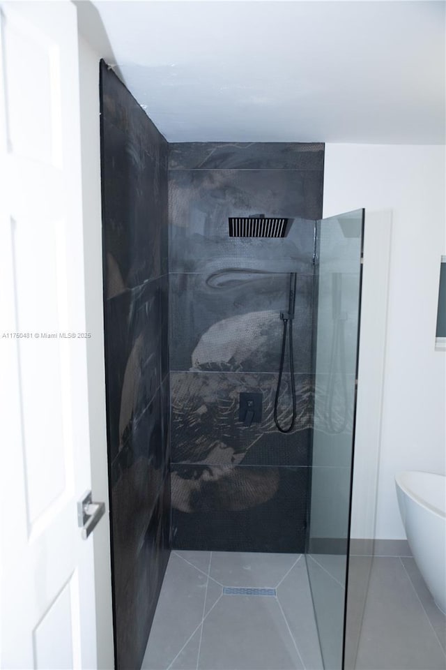 bathroom featuring tile patterned flooring and walk in shower