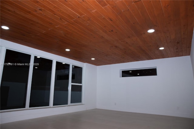 spare room with recessed lighting, wooden ceiling, and baseboards