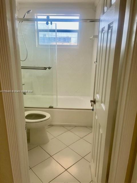 5050 Bayview Dr Unit 17, Fort Lauderdale, FL 33308 - bathroom featuring enclosed tub / shower combo, tile patterned flooring, and toilet