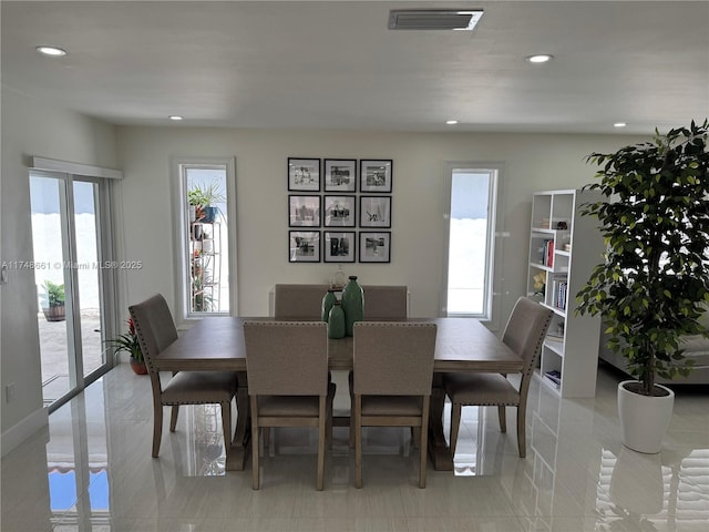 dining room with visible vents and recessed lighting