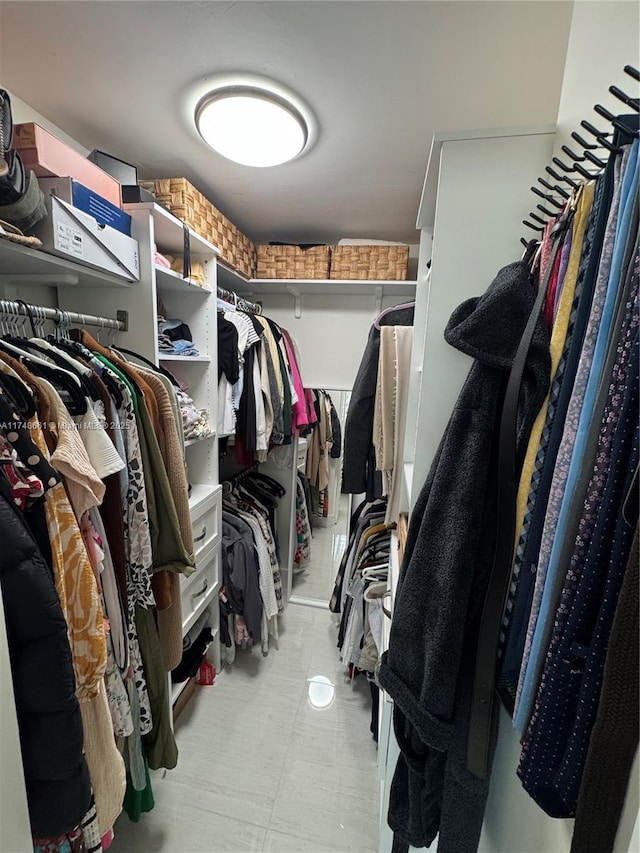 spacious closet featuring light floors