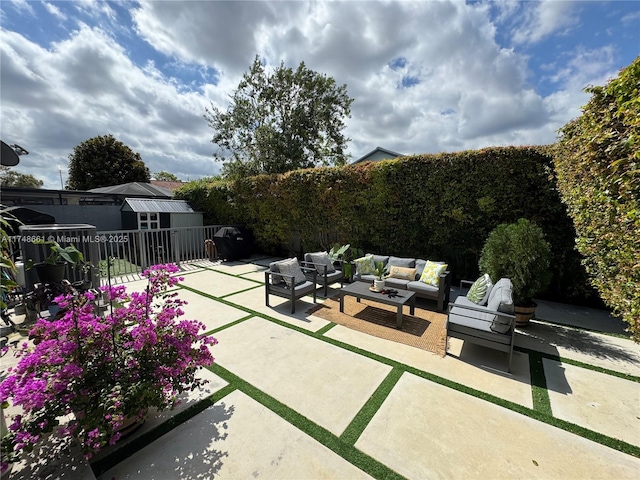 view of patio featuring outdoor lounge area and a fenced backyard