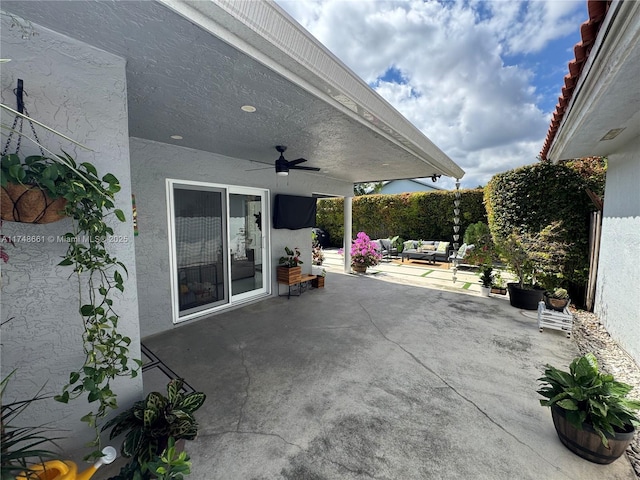 view of patio with ceiling fan and a fenced backyard