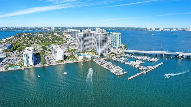 drone / aerial view featuring a water view and a view of city