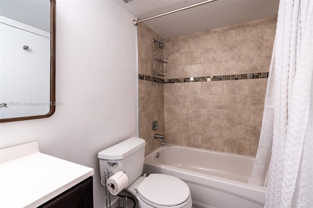 bathroom featuring toilet, shower / bath combo, and vanity