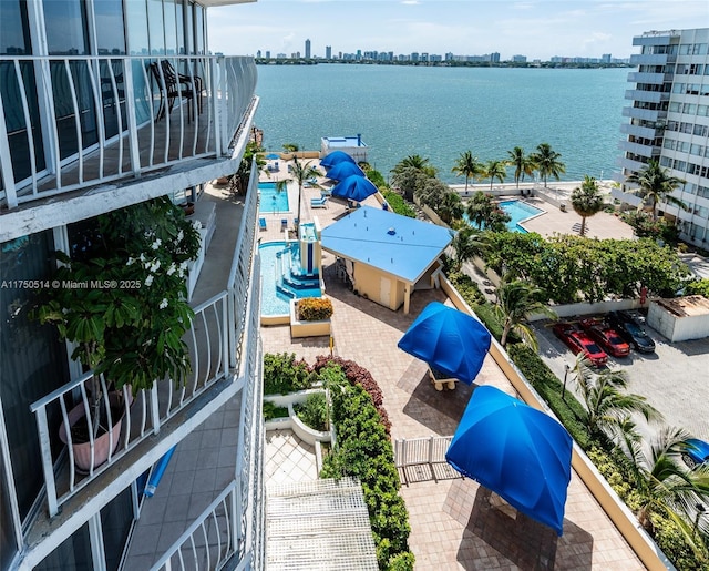 drone / aerial view featuring a water view and a city view