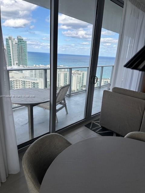 balcony with a view of city and a water view