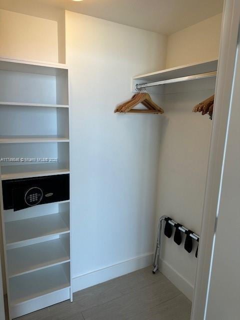 spacious closet featuring wood finished floors