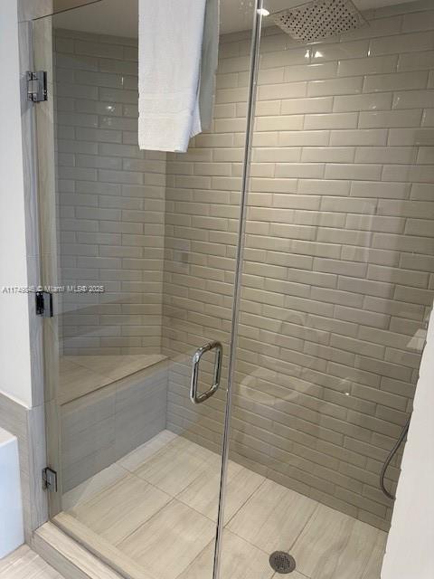 bathroom with a shower stall