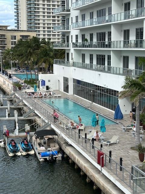 view of pool featuring a water view