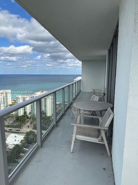 balcony featuring a water view