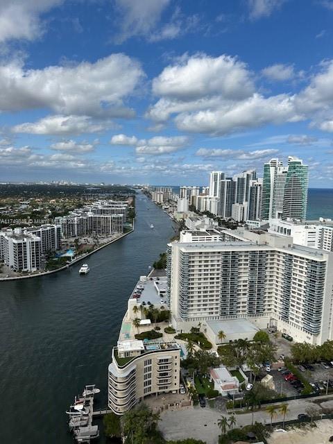 drone / aerial view with a view of city and a water view