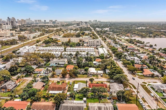 drone / aerial view featuring a water view and a city view