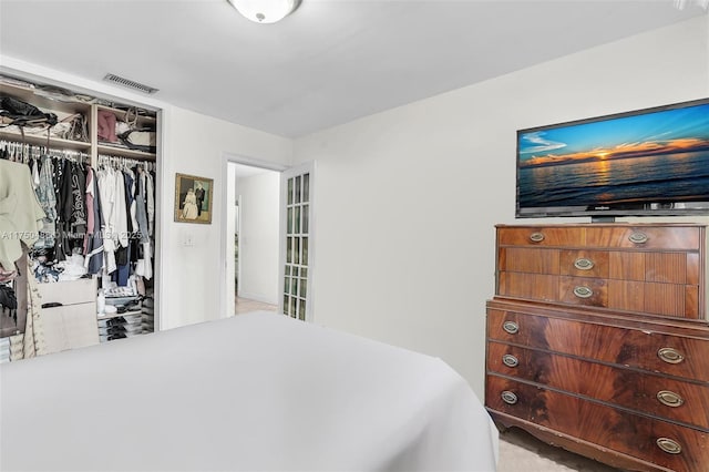 bedroom featuring visible vents and a closet