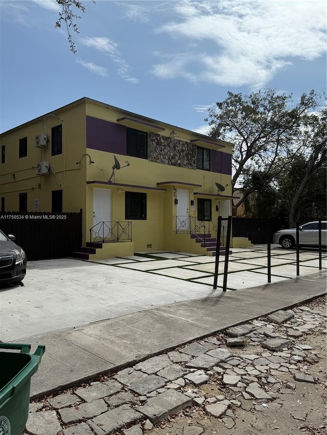 view of building exterior with fence