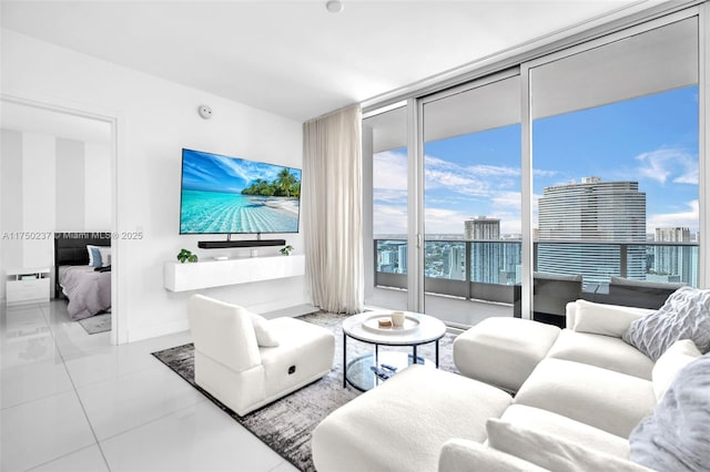 living room featuring floor to ceiling windows and baseboards