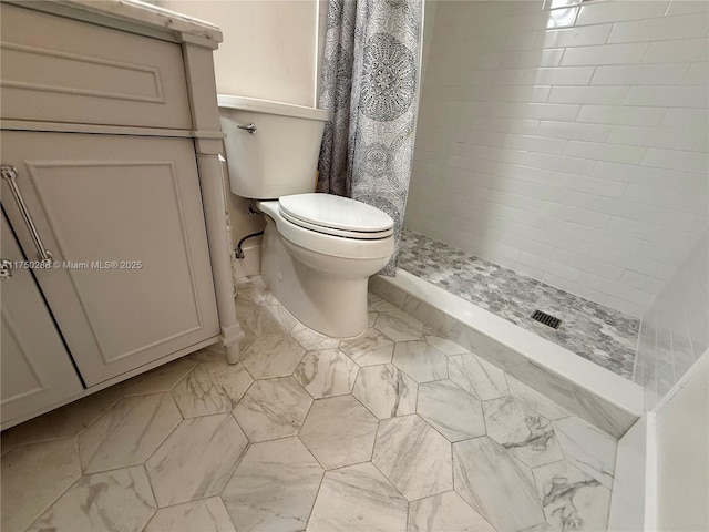 full bath with marble finish floor, a shower stall, and toilet