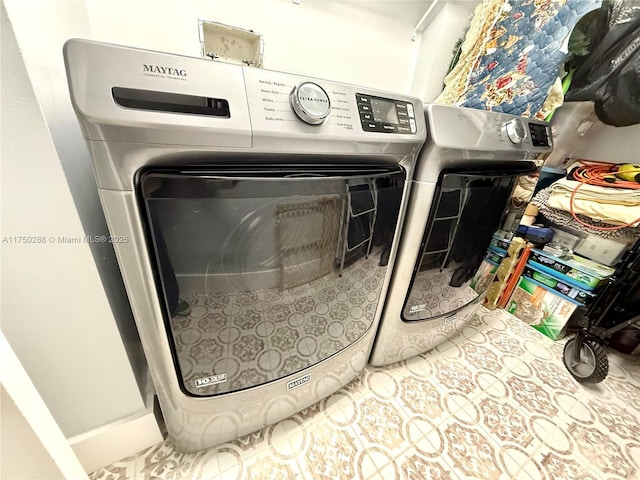 laundry area featuring laundry area, separate washer and dryer, and tile patterned floors