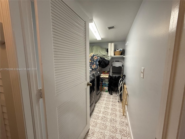 interior space featuring visible vents and washer and clothes dryer