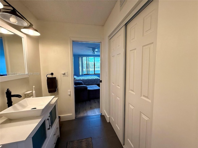 bathroom featuring visible vents, vanity, and ensuite bath