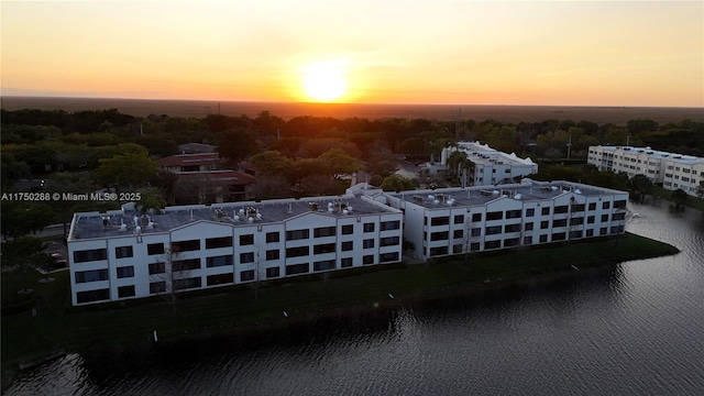 aerial view at dusk with a water view