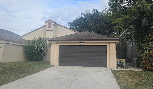 garage featuring concrete driveway