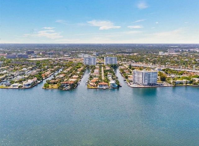 drone / aerial view featuring a water view and a view of city