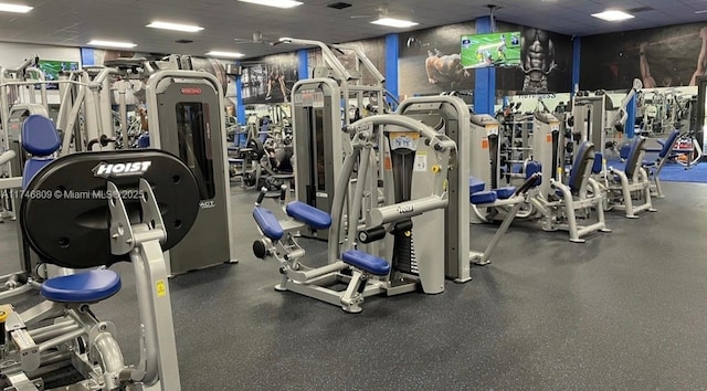 exercise room featuring a drop ceiling