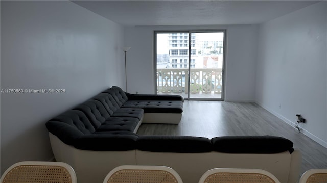 living room with light wood-style floors and baseboards