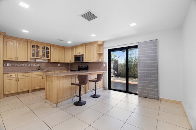 kitchen featuring range with electric cooktop, visible vents, glass insert cabinets, stainless steel microwave, and open shelves