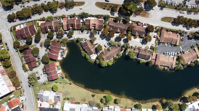 bird's eye view featuring a residential view and a water view