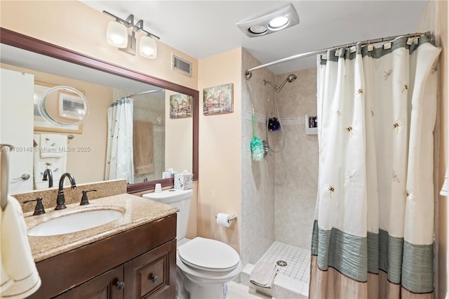 full bath featuring toilet, a stall shower, vanity, and visible vents