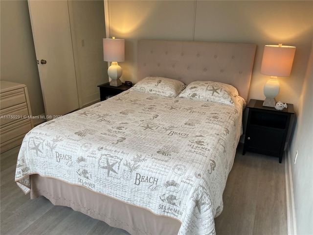 bedroom featuring wood finished floors