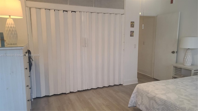 bedroom with wood finished floors