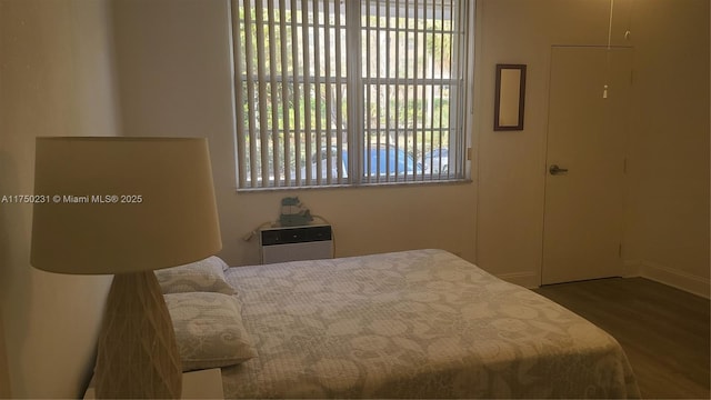 bedroom with wood finished floors