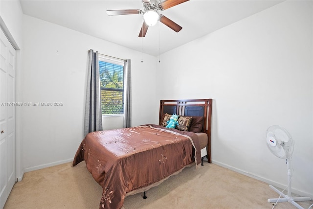 bedroom with baseboards, carpet floors, and a ceiling fan