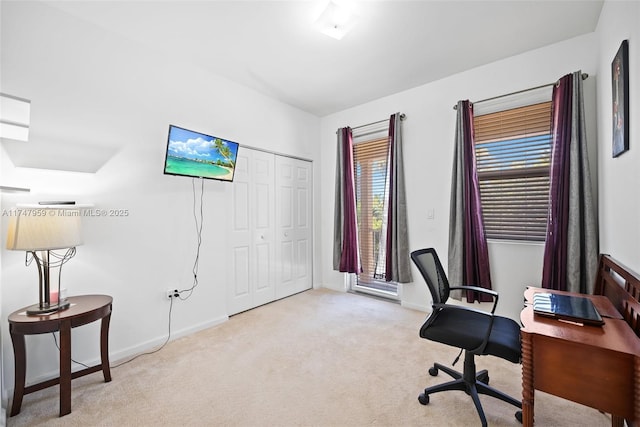 home office featuring carpet and baseboards