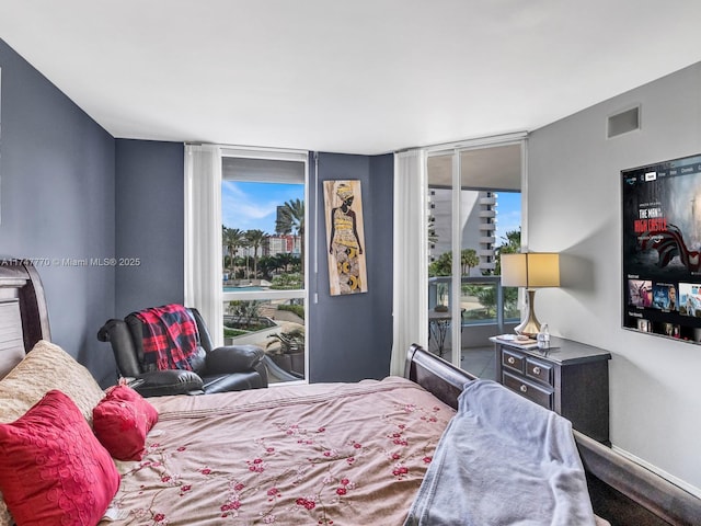 21205 Yacht Club Dr Unit 601, Aventura, FL 33180 - bedroom featuring floor to ceiling windows, access to outside, baseboards, and visible vents