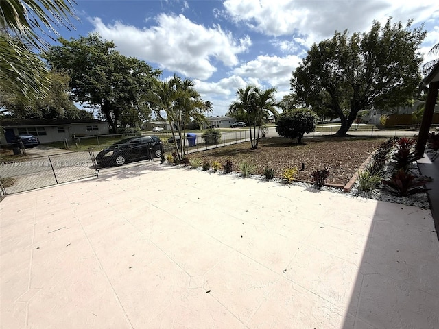 exterior space with fence and driveway