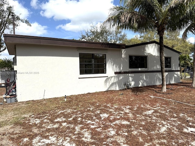 view of home's exterior with stucco siding