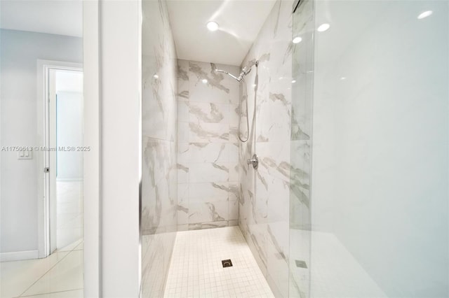 bathroom with a marble finish shower