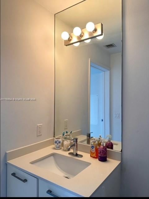 bathroom with visible vents and vanity